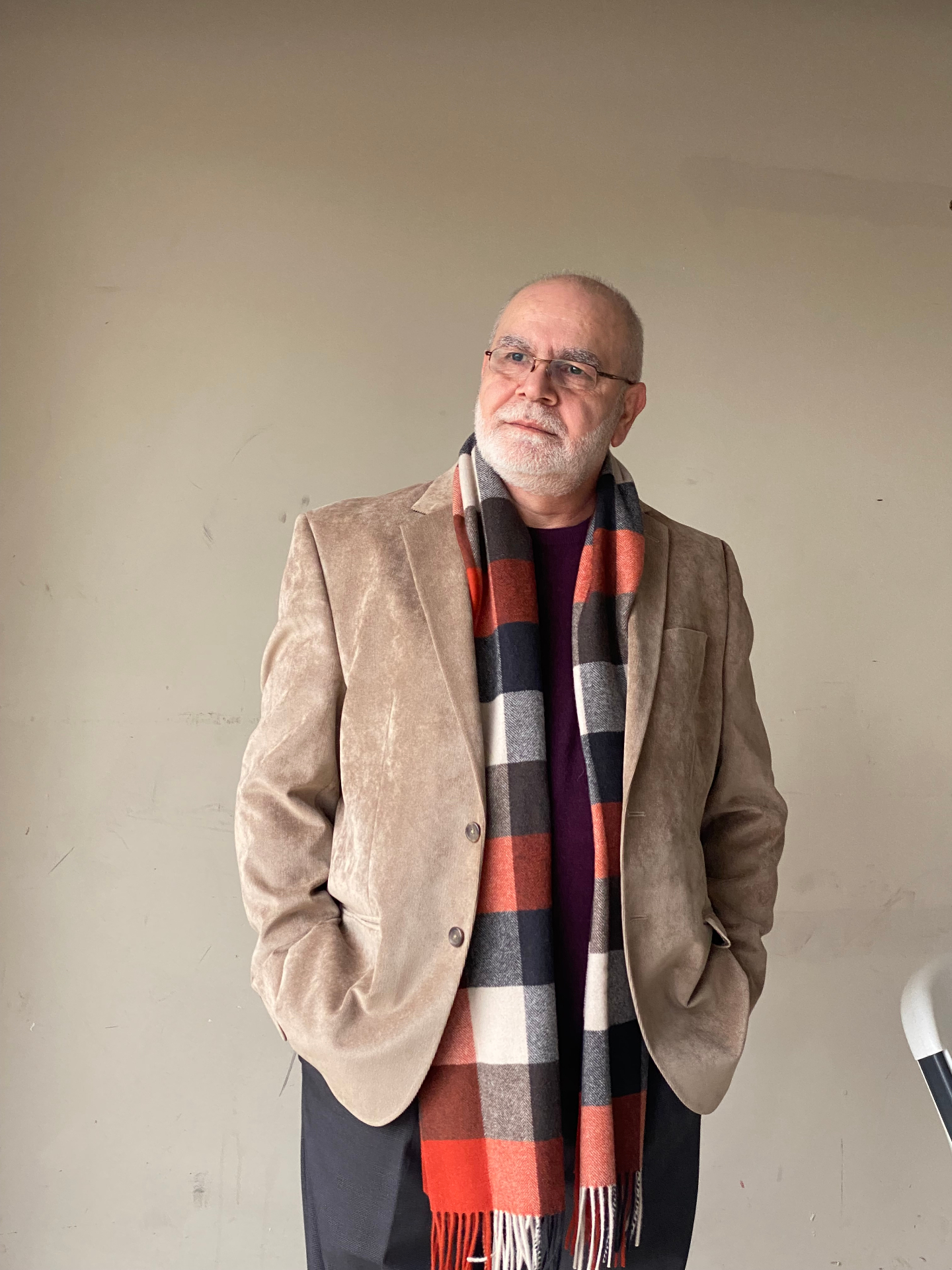 Professional portrait of Sam Elsaadi in a suede blazer.